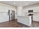Modern kitchen with stainless steel appliances and white cabinetry at 3494 N Irvington St, Aurora, CO 80019