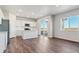 Modern kitchen with island, stainless steel appliances, and access to a patio at 3494 N Irvington St, Aurora, CO 80019