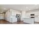Modern kitchen with island, stainless steel appliances, and access to a patio at 3494 N Irvington St, Aurora, CO 80019
