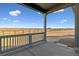 Covered porch with view of backyard and open space at 3494 N Irvington St, Aurora, CO 80019