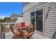 Back deck showcasing a small wooden table with view of a neighboring home at 1325 Kingsfield St, Castle Rock, CO 80104