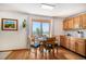 Cozy dining area featuring hardwood floors, a modern table set, and lots of light at 1325 Kingsfield St, Castle Rock, CO 80104