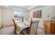 Bright dining room features a large window, a classic table setting, and stylish decor at 1325 Kingsfield St, Castle Rock, CO 80104
