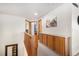 Hallway features wooden railing, neutral carpet, and built-in cabinets with white countertop at 1325 Kingsfield St, Castle Rock, CO 80104