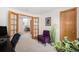 Cozy office with french doors, decorative plants, and comfortable seating area at 1325 Kingsfield St, Castle Rock, CO 80104
