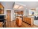 Spacious kitchen featuring hardwood floors, stainless steel appliances, and a center island at 1325 Kingsfield St, Castle Rock, CO 80104