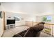 Upstairs living area with vaulted ceilings, wood railing, and views of the surrounding landscape at 1325 Kingsfield St, Castle Rock, CO 80104