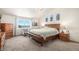 Spacious main bedroom features a large window and wooden furniture at 1325 Kingsfield St, Castle Rock, CO 80104