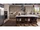 Modern kitchen featuring stainless steel appliances, a center island with seating, and sleek countertops at 6289 Cristobal Pt, Parker, CO 80134