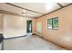 Eat-in kitchen featuring paneled walls, tile flooring, and a window at 12 Marshall Pl, Longmont, CO 80504