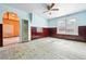 Living room showcasing light blue walls, paneled walls, and an archway at 12 Marshall Pl, Longmont, CO 80504