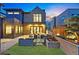 Stunning backyard patio with outdoor seating, water feature, and landscaped garden, perfect for relaxing and entertaining at 1130 S Cook St, Denver, CO 80210