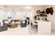Finished basement featuring a wet bar, lounge area, and stylish décor at 1130 S Cook St, Denver, CO 80210