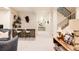 Finished basement with wet bar, open shelving, stairs to main floor and contemporary decor and stylish finishes at 1130 S Cook St, Denver, CO 80210