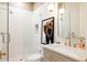 Modern bathroom featuring a glass-enclosed shower, floating vanity, and contemporary lighting fixtures at 1130 S Cook St, Denver, CO 80210