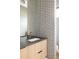 Stylish bathroom with patterned wallpaper, sleek vanity, and modern fixtures at 1130 S Cook St, Denver, CO 80210