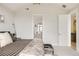 Bright bedroom offers an ensuite bathroom and abundant natural light at 1130 S Cook St, Denver, CO 80210