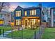 Stunning two-story home featuring a landscaped yard, modern architecture, and a welcoming front porch at 1130 S Cook St, Denver, CO 80210