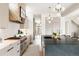 Well-equipped kitchen with stainless steel appliances, a large island, and sleek countertops at 1130 S Cook St, Denver, CO 80210