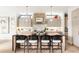 Stylish kitchen island with seating, modern lighting, and chic design elements at 1130 S Cook St, Denver, CO 80210