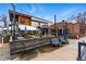 Charming outdoor seating area with umbrellas, tables, and benches, creating a welcoming space to dine and socialize at 1130 S Cook St, Denver, CO 80210