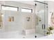 Beautiful glass shower with dual shower heads, built-in bench, and modern hardware at 1130 S Cook St, Denver, CO 80210
