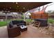 Backyard patio with comfortable seating, a hot tub, and stylish decor, creating a tranquil outdoor retreat at 8229 Estes Ct, Arvada, CO 80005