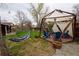 Beautiful backyard with gazebo, hammock, and lush greenery, creating a serene and inviting outdoor space at 8229 Estes Ct, Arvada, CO 80005