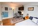 Inviting bedroom with hardwood floors, natural light, and a desk at 8229 Estes Ct, Arvada, CO 80005