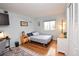 Inviting bedroom with hardwood floors, natural light, and closet at 8229 Estes Ct, Arvada, CO 80005