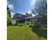 Charming two-story brick home with a well-manicured front yard and lush garden at 8229 Estes Ct, Arvada, CO 80005