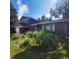 Charming home featuring a lush front yard with vibrant flowers and mature trees at 8229 Estes Ct, Arvada, CO 80005