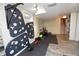 Spacious home gym features climbing wall, weightlifting area, mirrored wall, providing ample space for fitness activities at 8229 Estes Ct, Arvada, CO 80005