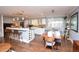 Bright kitchen features a wine rack, updated cabinets and stone countertops at 8229 Estes Ct, Arvada, CO 80005