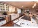 Bright kitchen featuring granite countertops, stainless appliances and an island cooktop at 8229 Estes Ct, Arvada, CO 80005