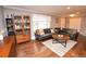 Inviting living room with hardwood floors, stylish furniture, and ample natural light from the large window at 8229 Estes Ct, Arvada, CO 80005