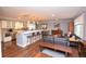 Bright, open-concept living space with a modern kitchen, dining area, and comfortable seating at 8229 Estes Ct, Arvada, CO 80005