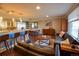 Bright, open-concept living space with a modern kitchen, dining area, and comfortable seating at 8229 Estes Ct, Arvada, CO 80005