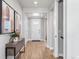 Bright and welcoming entryway featuring hardwood floors, stylish console table, and modern decor at 16320 W 92Nd Cir, Arvada, CO 80007