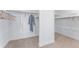 Bright walk-in closet featuring modern shelving and ample space for clothing storage and organization at 16320 W 92Nd Cir, Arvada, CO 80007
