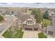 Aerial view of a well-maintained two-story home with an attached garage in a lovely neighborhood at 2649 S Kline Cir, Lakewood, CO 80227