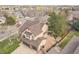 Aerial view of a beautifully landscaped home with fenced-in backyard and patio area perfect for entertaining at 2649 S Kline Cir, Lakewood, CO 80227