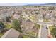 Residential neighborhood with well-maintained homes, mature trees, and beautiful mountain views in the background at 2649 S Kline Cir, Lakewood, CO 80227