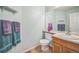 Charming bathroom with a single vanity, neutral walls, and decorative accents at 2649 S Kline Cir, Lakewood, CO 80227
