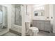 Modern bathroom with glass enclosed shower, sleek vanity, and stylish fixtures at 2649 S Kline Cir, Lakewood, CO 80227