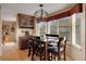 Cozy dining room featuring wood floors, modern lighting, and a built-in cabinet at 2649 S Kline Cir, Lakewood, CO 80227