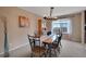 Bright dining room with a modern chandelier, neutral walls, and carpeted floors at 2649 S Kline Cir, Lakewood, CO 80227