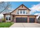 Charming two-story home features a well-maintained front yard and attached two car garage at 2649 S Kline Cir, Lakewood, CO 80227