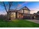 Charming two-story home with a well-manicured lawn and a spacious three-car garage, perfect for a growing Gathering at 2649 S Kline Cir, Lakewood, CO 80227