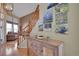 Inviting foyer with hardwood floors, a staircase, and a decorative console table at 2649 S Kline Cir, Lakewood, CO 80227